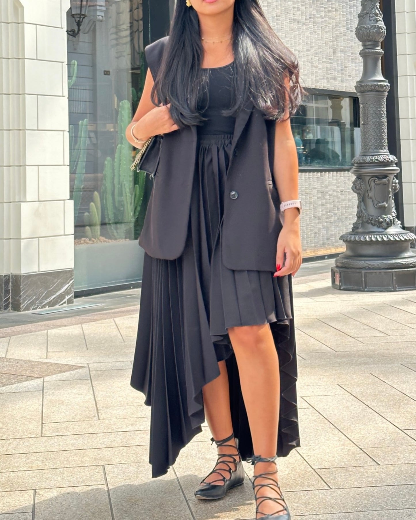 Asymmetrical hem pleated skirt