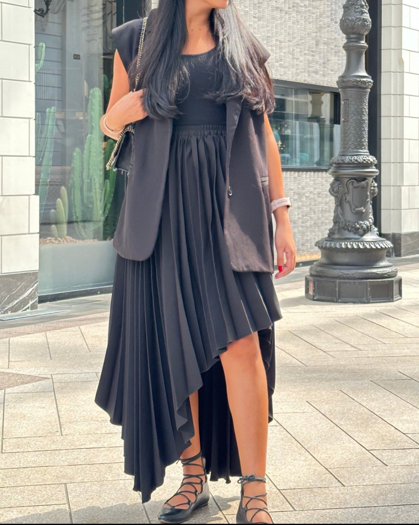 Asymmetrical hem pleated skirt